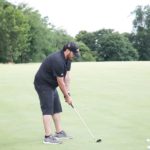 Golfer Preparing to Take Shot